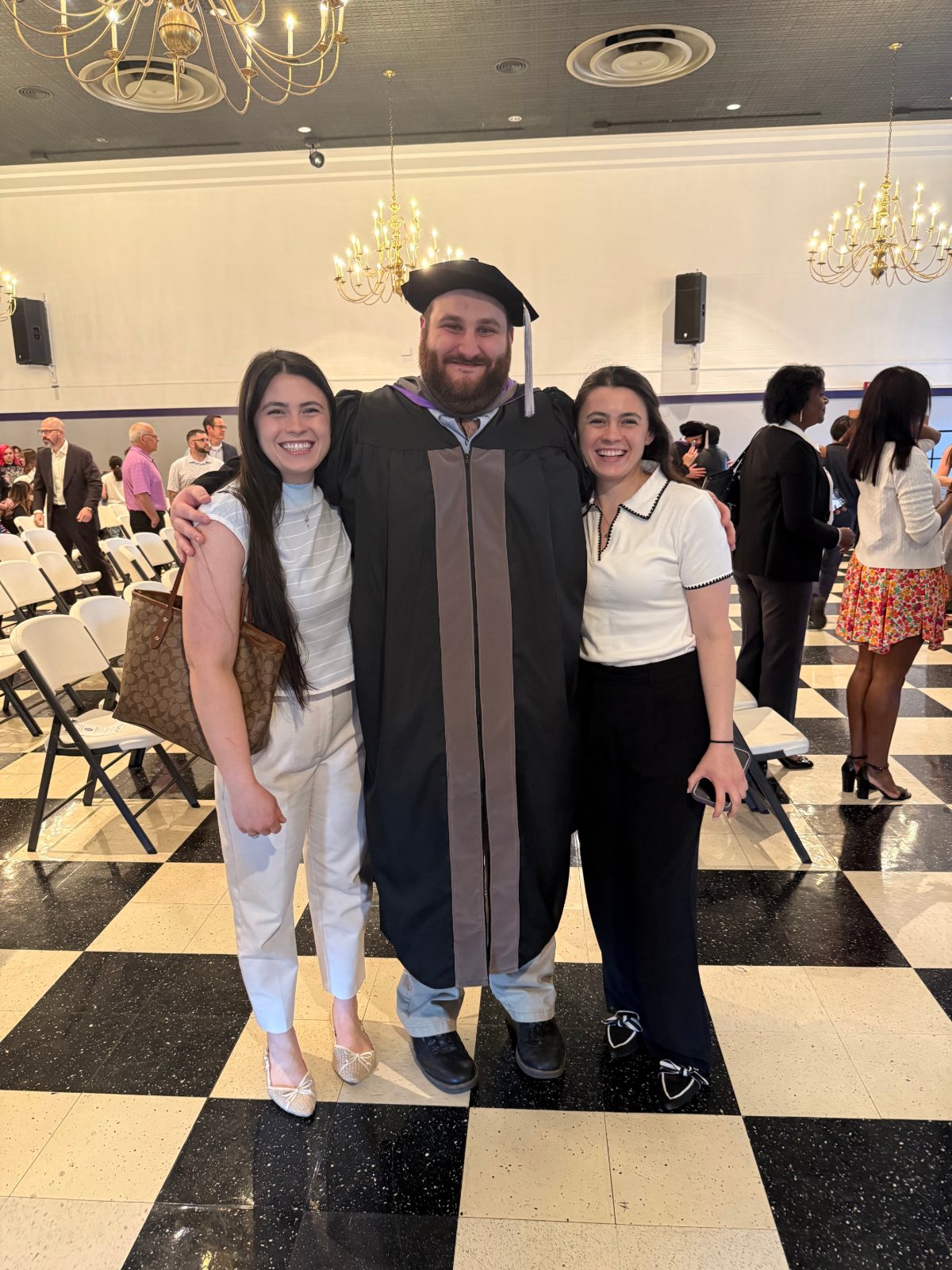 Dr. Rob Sanfilippo, Jr. in cap and gown on his graduation day